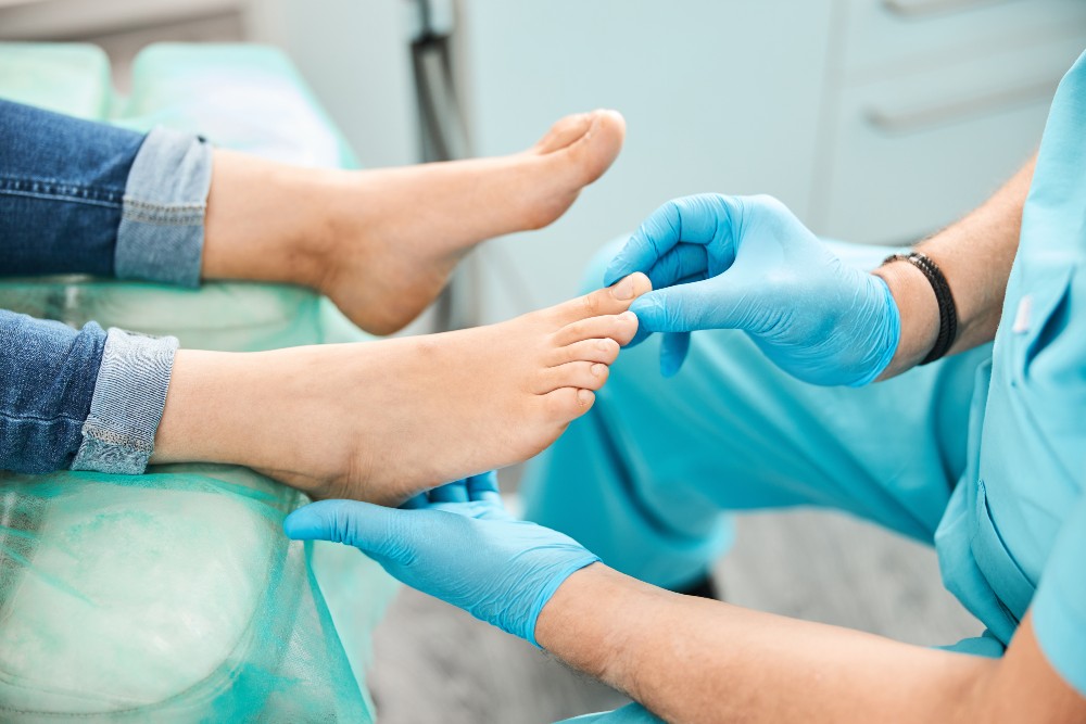 Doctor evaluating an ingrown toenail