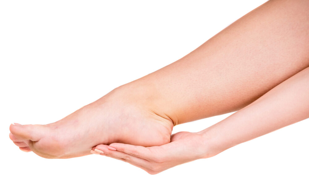 Grabbing heel due to plantar fasciitis heel pain